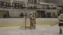 a hockey player with the number 15 on his jersey stands on the ice