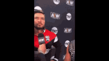 a man with his eyes closed is wearing a red jacket that says look at the disgust