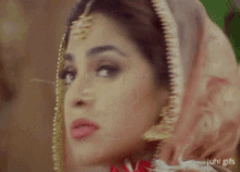 a close up of a woman 's face with the words " juhi gifs " on the bottom right