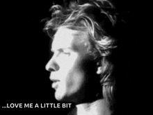 a black and white photo of a man with the words love me a little bit