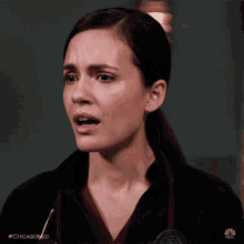 a close up of a woman 's face with the hashtag #chicagomed on the bottom