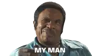 a man in a blue shirt is pointing at the camera with the words my man behind him