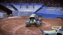 a monster jam advertisement with a shark and a monster truck