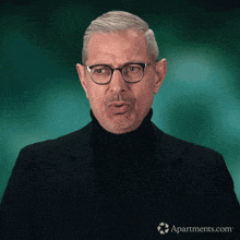a man wearing glasses and a black turtleneck has apartments.com written on the bottom right
