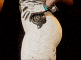a close up of a person 's butt with a glove on