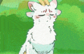 a white cat with a yellow crown on its head is standing in the grass .