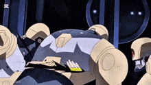 a group of robots are gathered together in a dark room