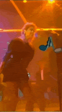 a purple background with balloons and a person in the background