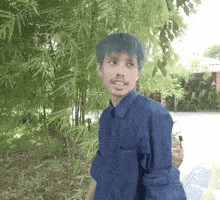 a man with blue hair and a beard is standing in front of a bamboo tree