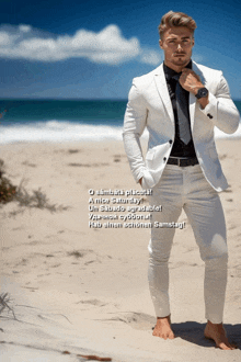 a man in a white suit stands on a beach