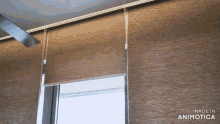 a window with blinds and a ceiling fan made by animatica
