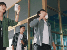 a man drinking from a cup that says starbucks