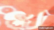 a close up of a person 's hand holding something in a blurry image .