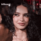 a close up of a woman 's face with the word billboard on the bottom