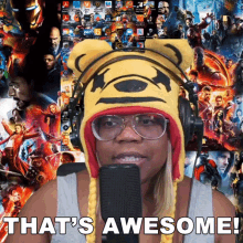 a woman wearing a winnie the pooh hat stands in front of a microphone and says " that 's awesome "