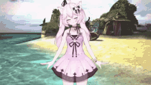 a girl in a purple dress stands on a beach with her arms outstretched