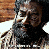 a man with a beard and scarf says i 'm exhausted ma