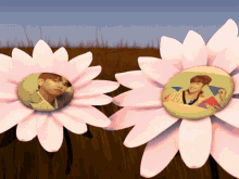 two pink flowers with a picture of a man and a woman inside of them