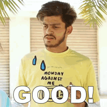a man wearing a yellow t-shirt that says monday against me