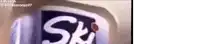 a close up of a ski can with a red dot on it .