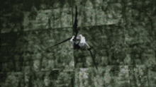 a man is holding a large sword in his hand while fighting another man .