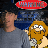 a man stands in front of a sign that says warning