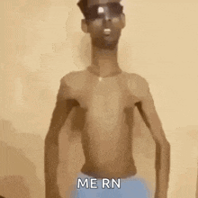 a shirtless man wearing sunglasses and blue underwear is standing in front of a wall and says `` me rn '' .