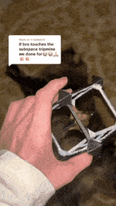 a person holding a cube in their hand with a reply to the comment