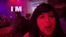 a woman wearing a red wig with the word lil on it