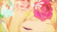 a close up of a girl 's face with flowers on her head