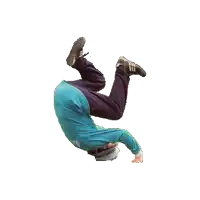 a man in a blue shirt and black pants is doing a handstand