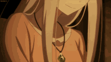 a close up of a woman 's neck with a green pendant on it and the words sanime.tv on the bottom