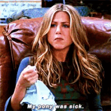 a woman is sitting on a couch holding a piece of paper and saying " my pony was sick "