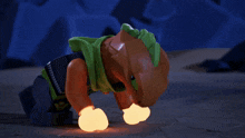 a cartoon character with glowing gloves and a green cape