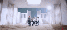 a group of people are dancing in front of a large white building