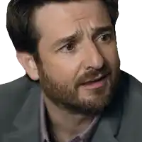 a close up of a man 's face with his eyes closed