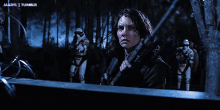 a woman is holding a rifle in front of a group of storm trooper soldiers ..