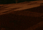 a cartoon character with a white mask on his face is standing on a sidewalk .