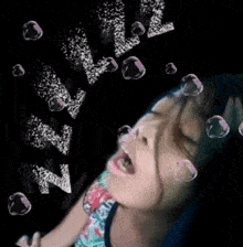 a girl with her mouth open and bubbles coming out of it