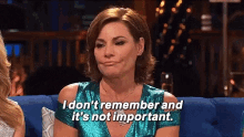 a woman in a blue dress says i don 't remember and it 's not important .