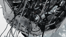 a close up of a metal object with wires coming out of it and the letters n and p on it