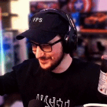 a man wearing headphones and a hat that says fps on it