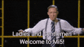 a woman in a suit and tie says " ladies and gentlemen welcome to mi 5 "