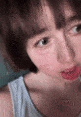a close up of a person 's face with their mouth open