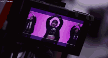 a group of women are dancing on a screen with the words honeycam.org at the top
