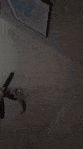 a blurred image of a person 's arm with a black background