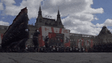 soldiers marching in front of a building with a sign that says " g yum "