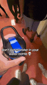 a person holding a water bottle with a caption that says " don 't put monster in your water bottle "