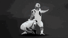 a man with a beard wearing a nfl jersey