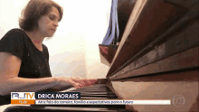 a woman playing a piano with a rjtv headline